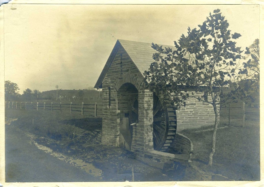 A black and white photo of a pumphouse.