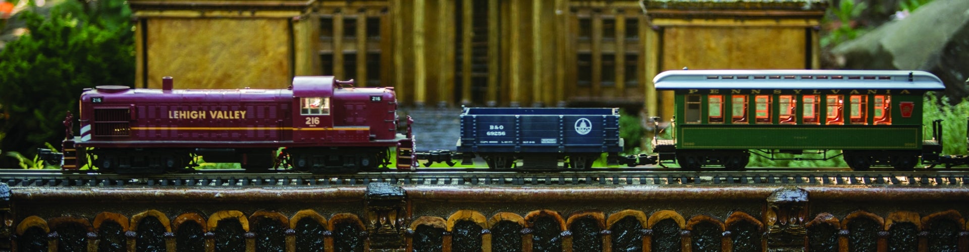 The first three cars of a model train.