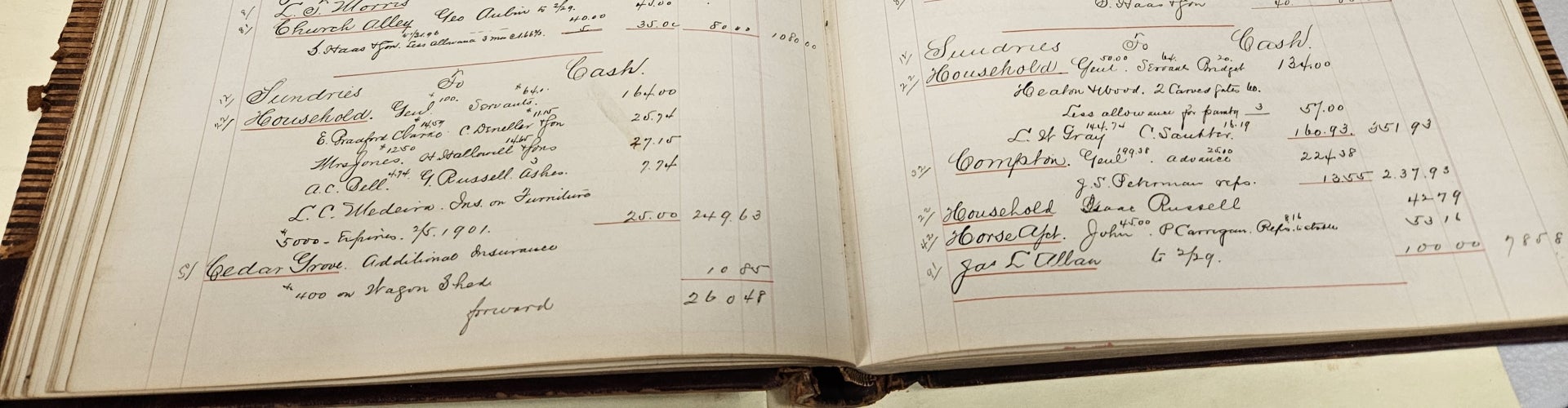 An open ledger book with handwritten entries on white pages