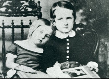 A black and white photograph of two young children in 1854.