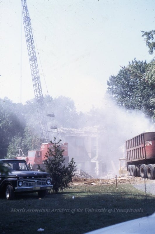 A color photograph from 1968 of a building being demolished.