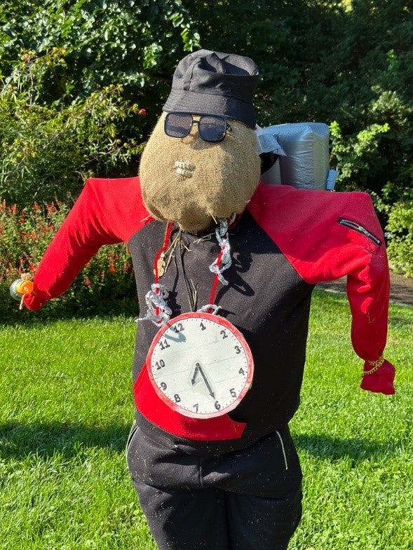 A scarecrow designed to look like Flava Flav.