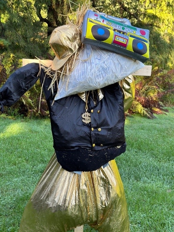 A scarecrow designed to look like MC Hammer.