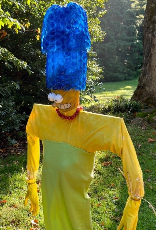 A scarecrow designed to look like Marge Simpson.