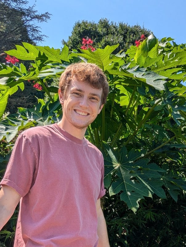 Young man with red hair in a light red t-shirt